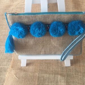 Small clutch with Pompoms